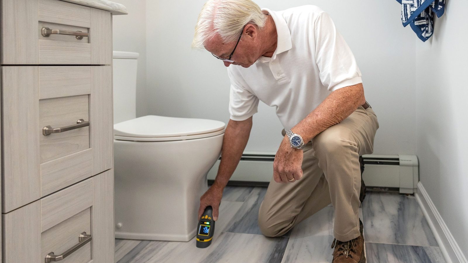 Checking a bathroom for a plumbing problem